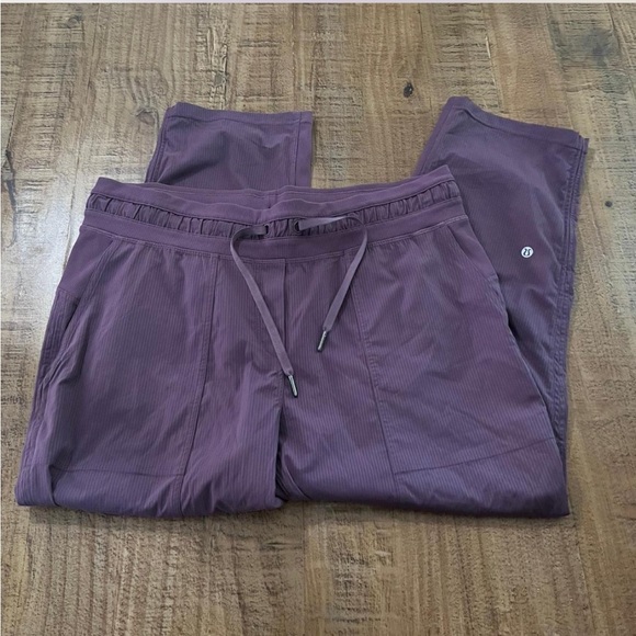 Women's Lululemon Dance Studio Mid-Rise Cropped Pant in a dark purple color. - Picture 1 of 5